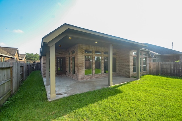 13806 Crystal Harbor Ln, Pearland, TX 77584 - rear view of house with brick siding and a patio area