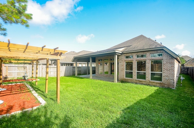 13806 Crystal Harbor Ln, Pearland, TX 77584 - back of property featuring brick siding, a patio area, and a shingled roof