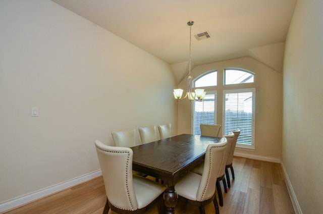 13806 Crystal Harbor Ln, Pearland, TX 77584 - dining space with a chandelier, light wood-style flooring, baseboards, healthy amount of natural light, and lofted ceiling
