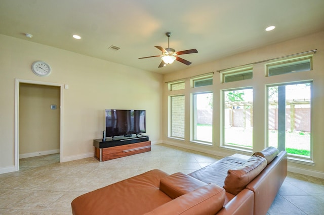 13806 Crystal Harbor Ln, Pearland, TX 77584 - living area featuring healthy amount of natural light, light tile patterned floors, ceiling fan, baseboards, and recessed lighting