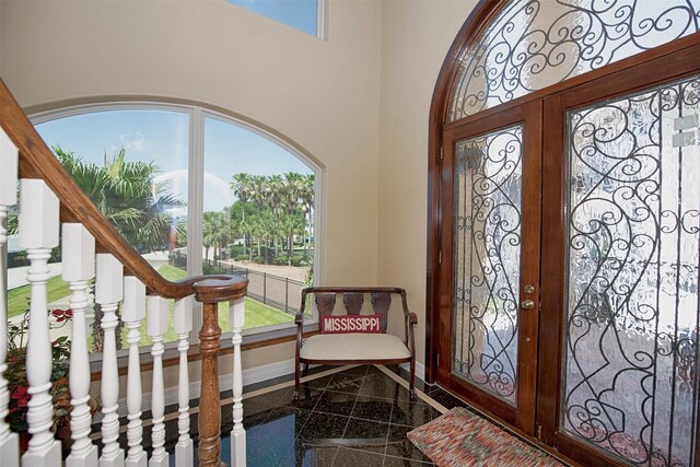 2242 Marina Way, League City, TX 77565 - entrance foyer featuring granite floors, baseboards, and inlaid floor details