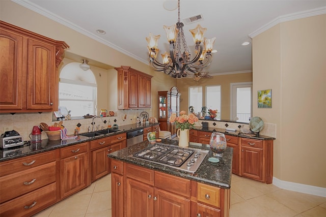 2242 Marina Way, League City, TX 77565 - kitchen featuring appliances with stainless steel finishes, a sink, a chandelier, light tile patterned flooring, and ornamental molding