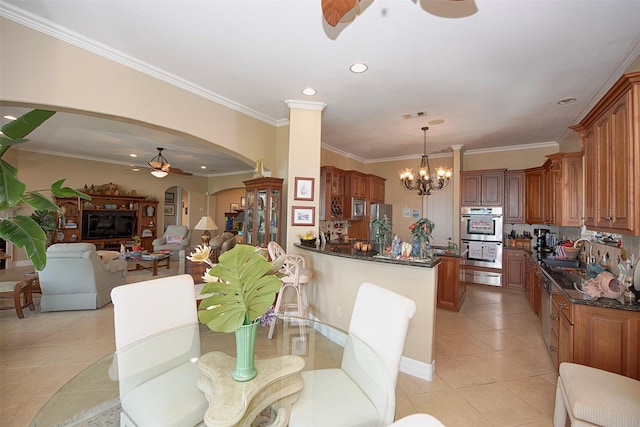 2242 Marina Way, League City, TX 77565 - dining room with ceiling fan, arched walkways, a chandelier, light tile patterned floors, and ornamental molding