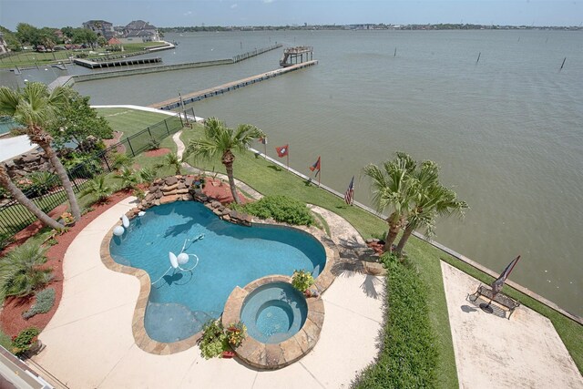 2242 Marina Way, League City, TX 77565 - view of pool with a fenced backyard, a water view, and a pool with connected hot tub