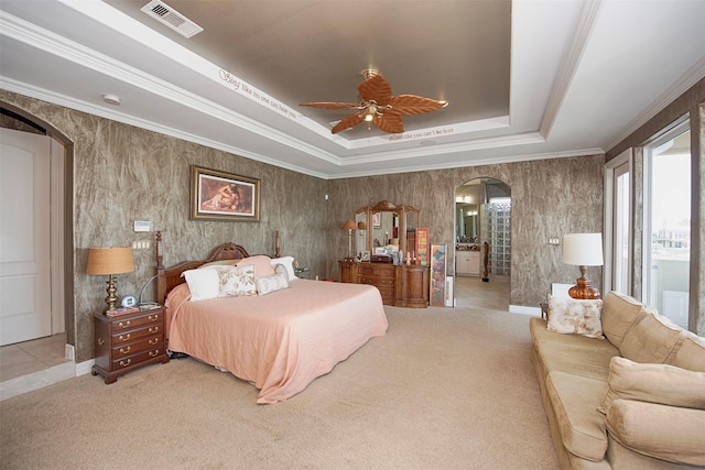 2242 Marina Way, League City, TX 77565 - bedroom with arched walkways, a tray ceiling, light colored carpet, and ceiling fan