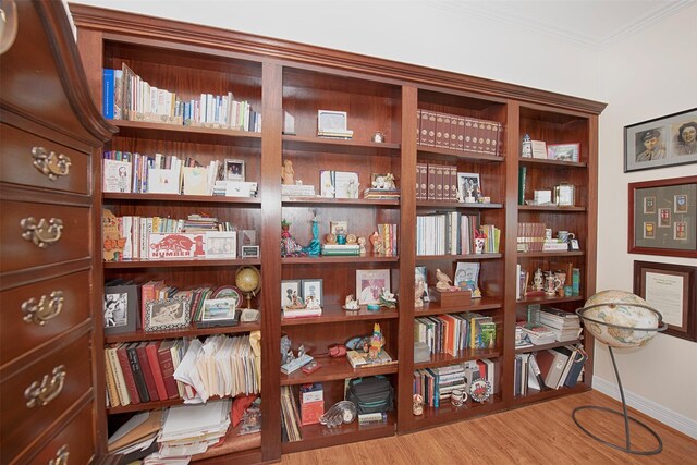 2242 Marina Way, League City, TX 77565 - sitting room featuring ornamental molding, wood finished floors, and baseboards