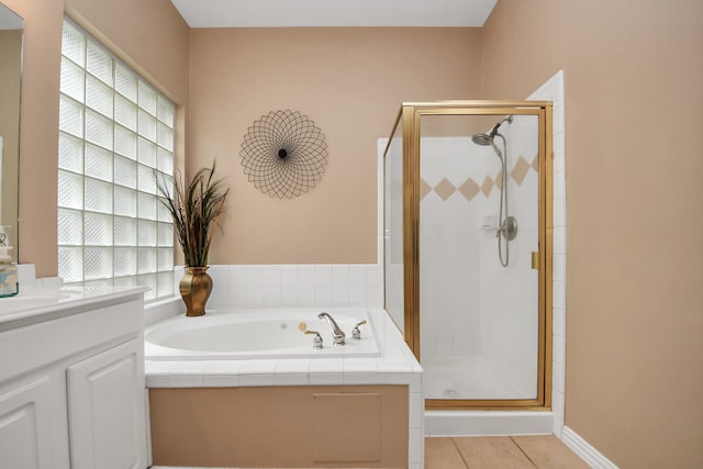 18110 Dovefield Ln, Cypress, TX 77433 - full bath featuring a stall shower, vanity, a bath, and tile patterned floors