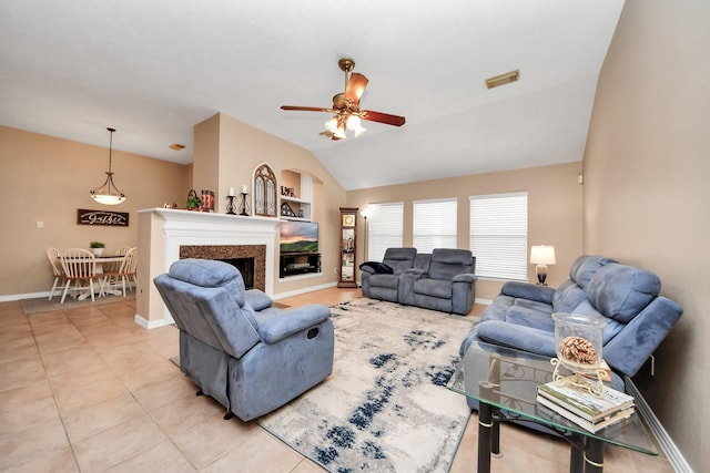 18110 Dovefield Ln, Cypress, TX 77433 - living area with vaulted ceiling, ceiling fan, light tile patterned floors, baseboards, and a fireplace