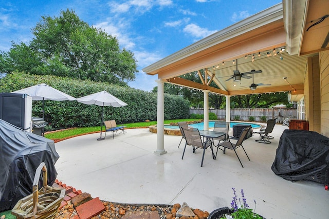 18110 Dovefield Ln, Cypress, TX 77433 - fenced backyard with a ceiling fan, a patio area, and grilling area