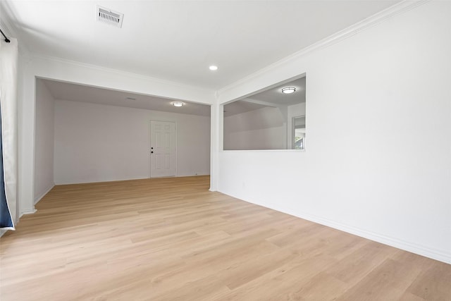 7817 Woodlyn Rd, Houston, TX 77028 - unfurnished room with crown molding, light wood finished floors, and baseboards