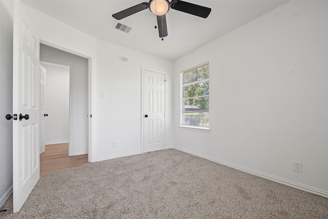 7817 Woodlyn Rd, Houston, TX 77028 - unfurnished bedroom featuring carpet flooring, baseboards, ceiling fan, and a closet