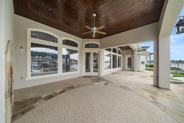 169 Westlake Pt, Montgomery, TX 77356 - view of patio featuring a ceiling fan and a water view