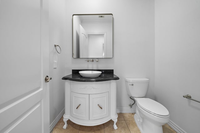 169 Westlake Pt, Montgomery, TX 77356 - half bath with toilet, vanity, baseboards, and tile patterned floors