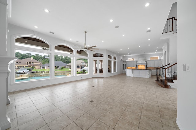 169 Westlake Pt, Montgomery, TX 77356 - unfurnished living room featuring ceiling fan, recessed lighting, stairs, and light tile patterned floors