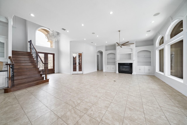 169 Westlake Pt, Montgomery, TX 77356 - unfurnished living room featuring built in features, a ceiling fan, light tile patterned floors, a glass covered fireplace, and recessed lighting