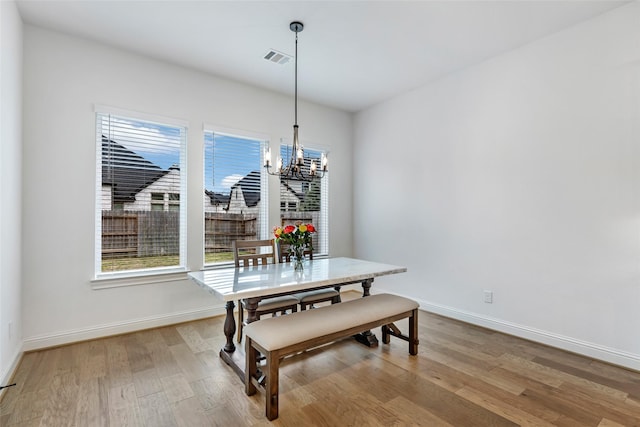 11914 Parsifal Creek Rd, Humble, TX 77346 - dining space featuring healthy amount of natural light, light wood finished floors, a chandelier, and baseboards