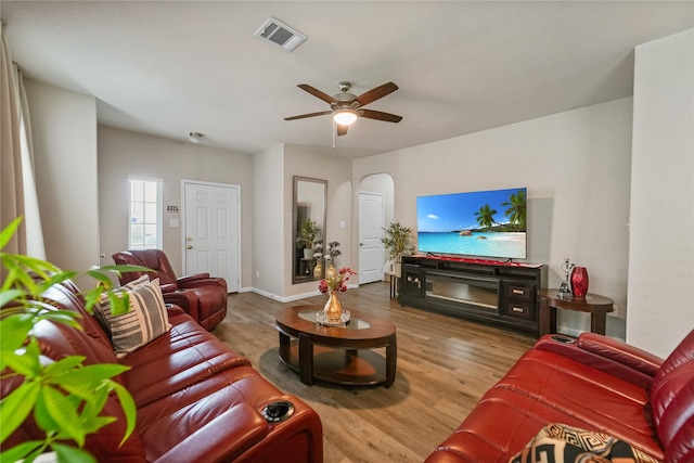23659 Goodfellow Dr, Spring, TX 77373 - living area with wood finished floors, a ceiling fan, baseboards, and arched walkways