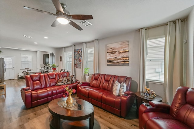 23659 Goodfellow Dr, Spring, TX 77373 - living room featuring a ceiling fan, light wood finished floors, arched walkways, and recessed lighting