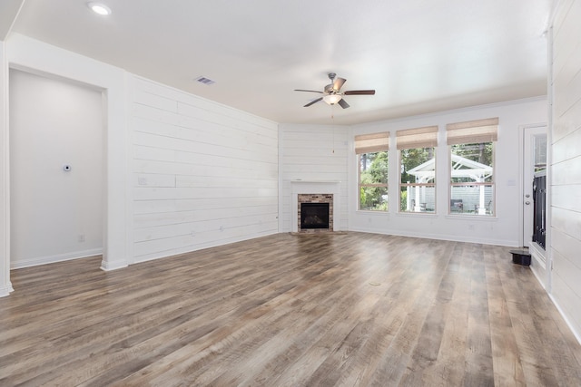 19276 Yellow Chestnut Ln, New Caney, TX 77357 - unfurnished living room with ceiling fan, wood finished floors, a fireplace, baseboards, and recessed lighting