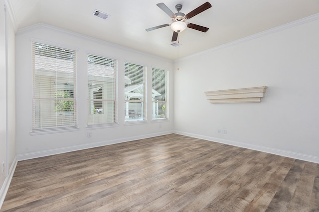 19276 Yellow Chestnut Ln, New Caney, TX 77357 - spare room with wood finished floors, a ceiling fan, baseboards, and crown molding