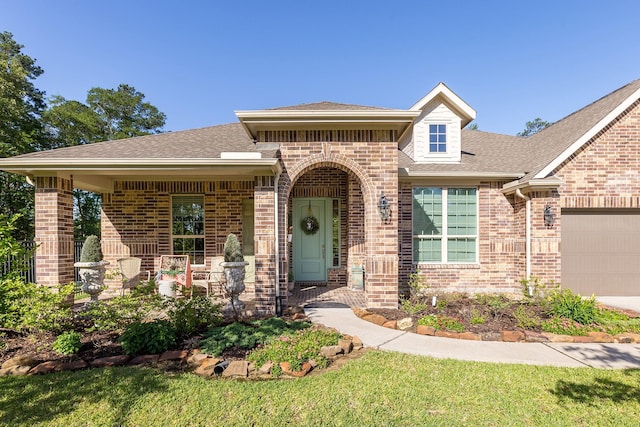 19276 Yellow Chestnut Ln, New Caney, TX 77357 - view of front of house with brick siding, an attached garage, and roof with shingles