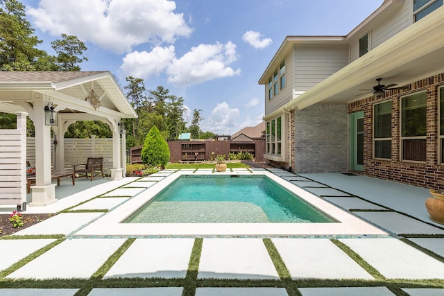 19276 Yellow Chestnut Ln, New Caney, TX 77357 - view of swimming pool featuring a patio, a fenced backyard, and a ceiling fan