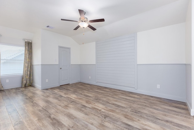 19276 Yellow Chestnut Ln, New Caney, TX 77357 - spare room with a ceiling fan, lofted ceiling, wood finished floors, and baseboards