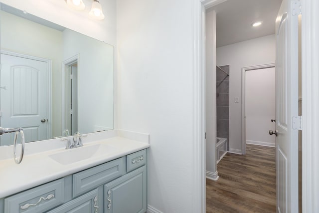 19276 Yellow Chestnut Ln, New Caney, TX 77357 - full bathroom with vanity, wood finished floors, baseboards, and shower / washtub combination