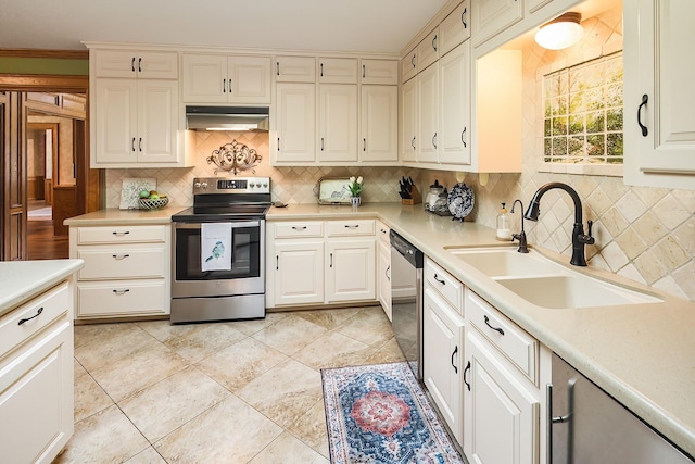 5151 Slippery Rock, Bryan, TX 77808 - kitchen featuring stainless steel appliances, under cabinet range hood, a sink, and decorative backsplash