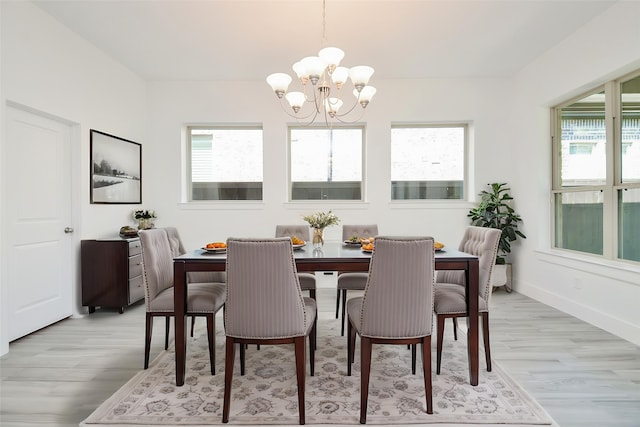 810 Sunbeam Creek Ct, Richmond, TX 77406 - dining space with a chandelier, healthy amount of natural light, and light wood-type flooring