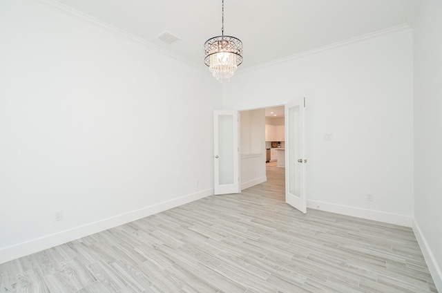 810 Sunbeam Creek Ct, Richmond, TX 77406 - spare room with baseboards, a chandelier, ornamental molding, and light wood-style flooring
