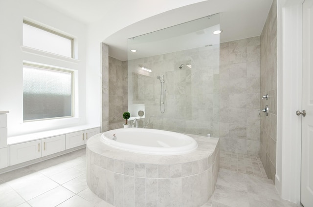 810 Sunbeam Creek Ct, Richmond, TX 77406 - bathroom with a bath, a walk in shower, tile patterned flooring, recessed lighting, and vanity