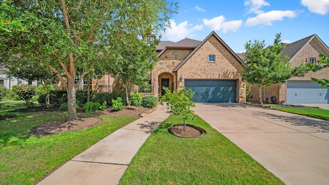 810 Sunbeam Creek Ct, Richmond, TX 77406 - view of front of home featuring stone siding, concrete driveway, a garage, a front lawn, and brick siding