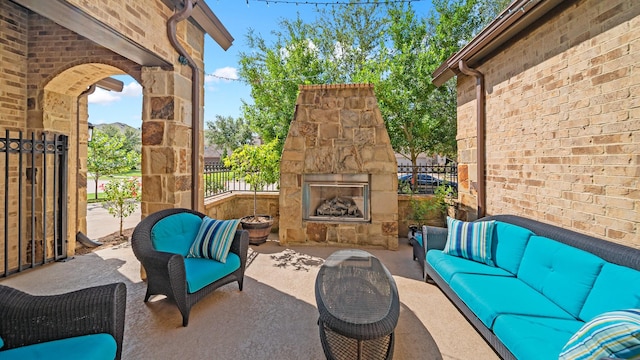 810 Sunbeam Creek Ct, Richmond, TX 77406 - view of patio / terrace with an outdoor living space with a fireplace