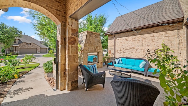 810 Sunbeam Creek Ct, Richmond, TX 77406 - view of patio / terrace featuring an outdoor living space with a fireplace