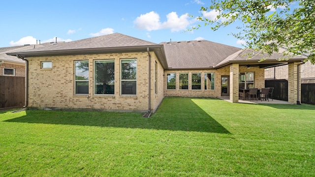 810 Sunbeam Creek Ct, Richmond, TX 77406 - rear view of house featuring a ceiling fan, a patio area, brick siding, and roof with shingles