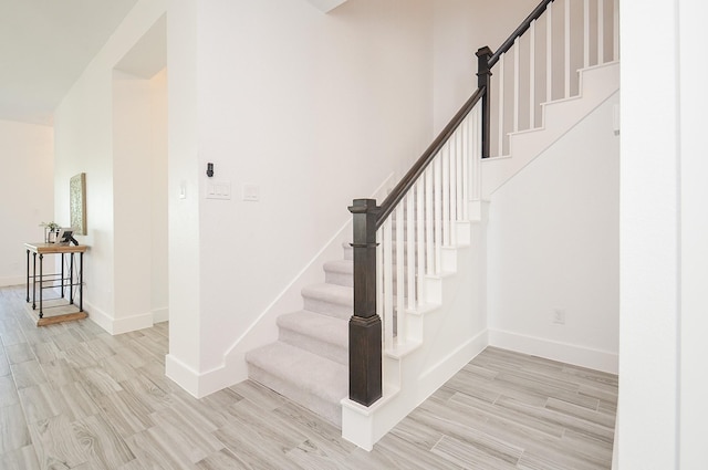 810 Sunbeam Creek Ct, Richmond, TX 77406 - stairs featuring wood finished floors and baseboards