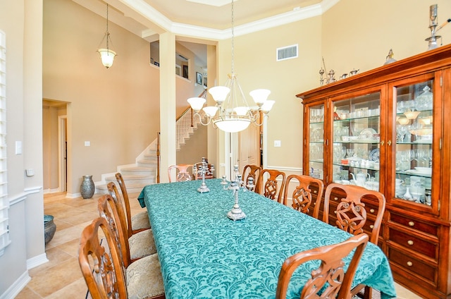 5703 Bent Arbor Ln, Katy, TX 77450 - dining space featuring a towering ceiling, light tile patterned flooring, a chandelier, and stairs