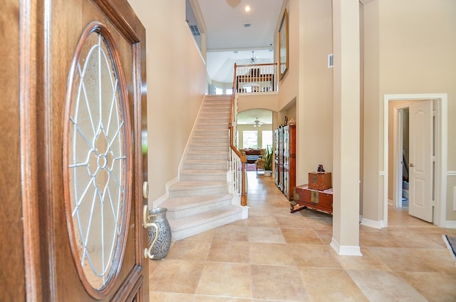 5703 Bent Arbor Ln, Katy, TX 77450 - entrance foyer with a high ceiling, stairs, french doors, light tile patterned flooring, and baseboards