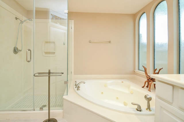 5703 Bent Arbor Ln, Katy, TX 77450 - bathroom featuring a shower stall and a tub with jets