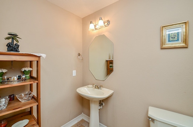 5703 Bent Arbor Ln, Katy, TX 77450 - bathroom with toilet and baseboards