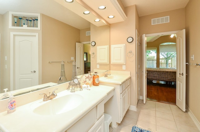 5703 Bent Arbor Ln, Katy, TX 77450 - ensuite bathroom featuring baseboards, tile patterned flooring, vanity, and recessed lighting