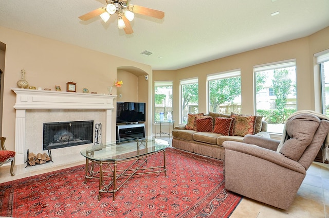 5703 Bent Arbor Ln, Katy, TX 77450 - living room with light tile patterned floors, plenty of natural light, a high end fireplace, and ceiling fan