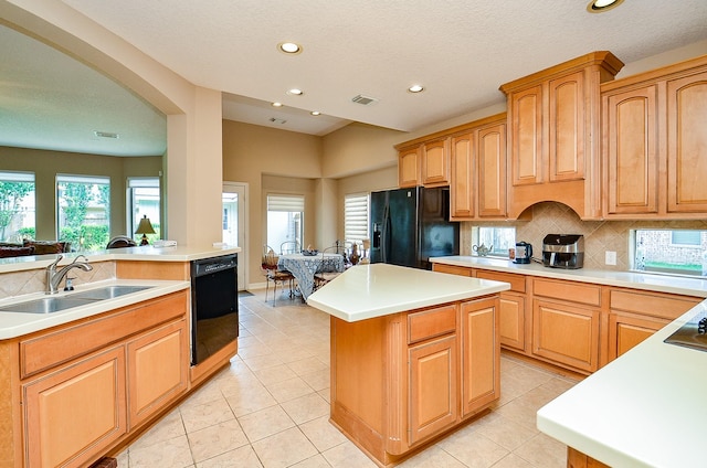 5703 Bent Arbor Ln, Katy, TX 77450 - kitchen featuring black appliances, a sink, recessed lighting, a kitchen island, and tasteful backsplash