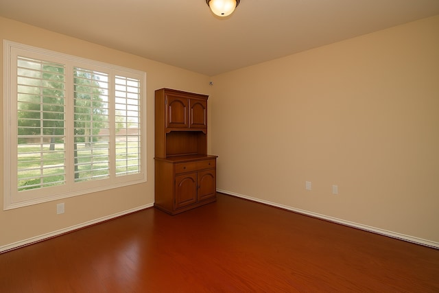 5703 Bent Arbor Ln, Katy, TX 77450 - unfurnished room featuring dark wood finished floors, plenty of natural light, and baseboards