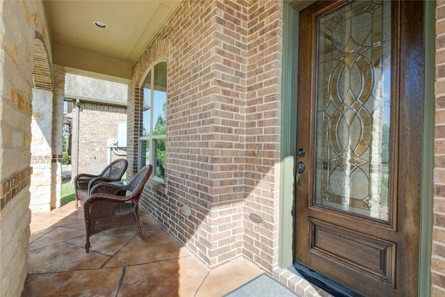 1417 Summer Field Ln, Friendswood, TX 77546 - property entrance featuring a porch and brick siding