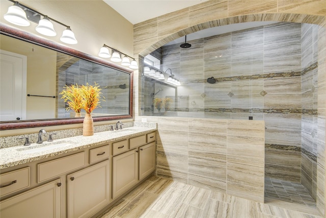 1417 Summer Field Ln, Friendswood, TX 77546 - bathroom featuring double vanity, a walk in shower, and tile walls