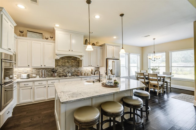 1417 Summer Field Ln, Friendswood, TX 77546 - kitchen featuring appliances with stainless steel finishes, a sink, healthy amount of natural light, backsplash, and recessed lighting