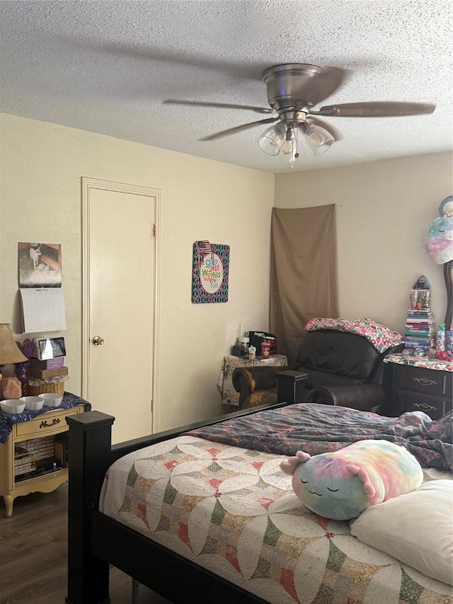 11110 Broken Sky Dr, Houston, TX 77064 - bedroom featuring wood finished floors, a ceiling fan, and a textured ceiling