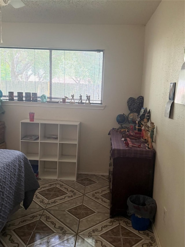 11110 Broken Sky Dr, Houston, TX 77064 - tiled bedroom featuring baseboards